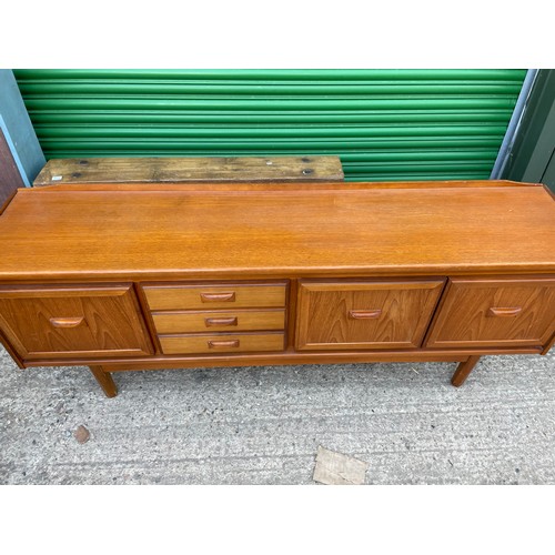 304 - A mid century teak sideboard