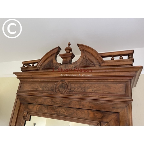 10 - A large french walnut and oak armoire wardrobe with mirror door over two drawers, fitted to the insi... 
