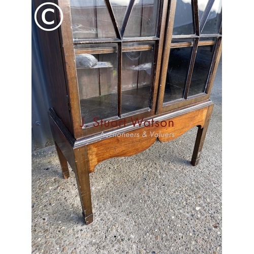 8 - A Victorian mahogany glazed bookcase with satinwood inlay and four adjustable shelves 81x35 x182