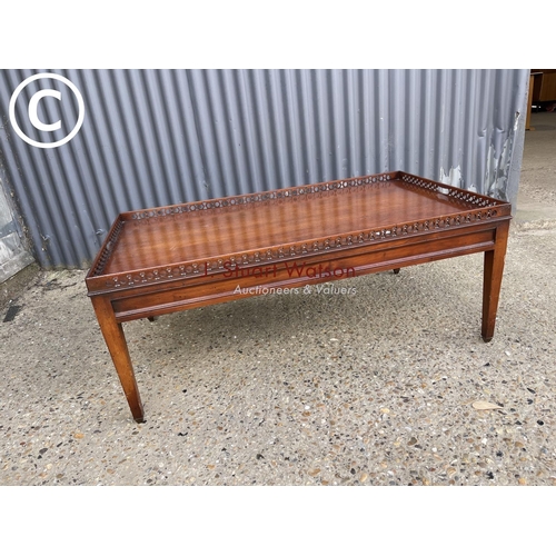 11 - A reproduction mahogany gallery top coffee table 120x70