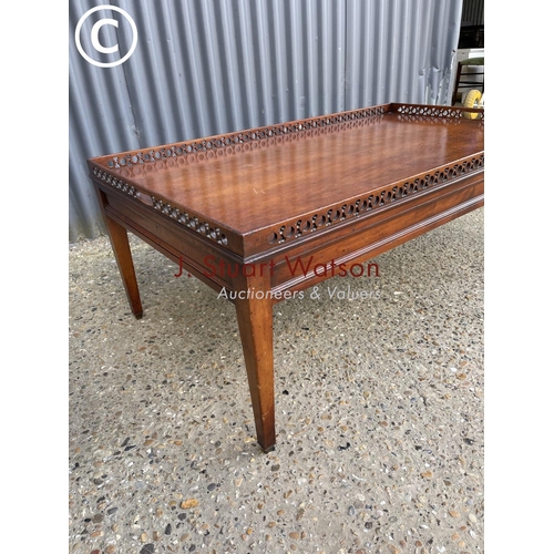 11 - A reproduction mahogany gallery top coffee table 120x70