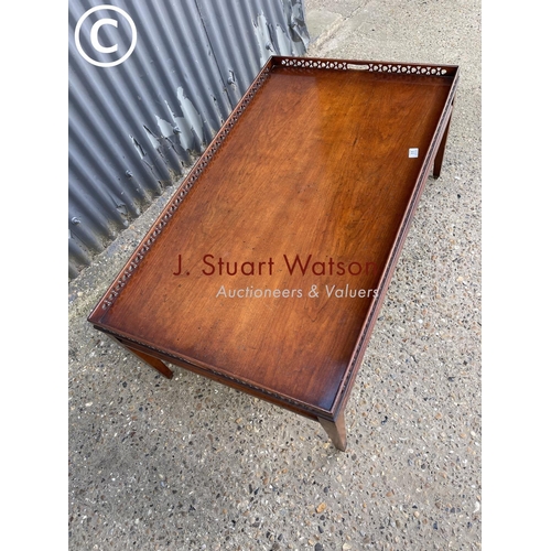 11 - A reproduction mahogany gallery top coffee table 120x70