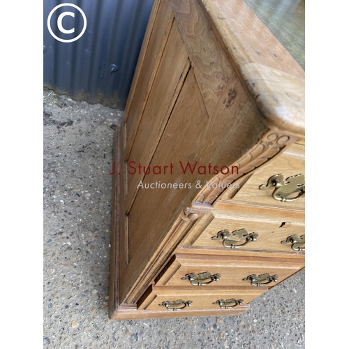 13 - An oak pedestal desk witrh a green leather top