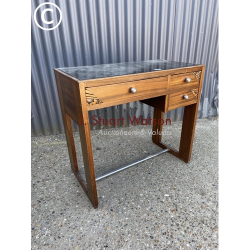 18 - A small Indonesian style three drawer desk