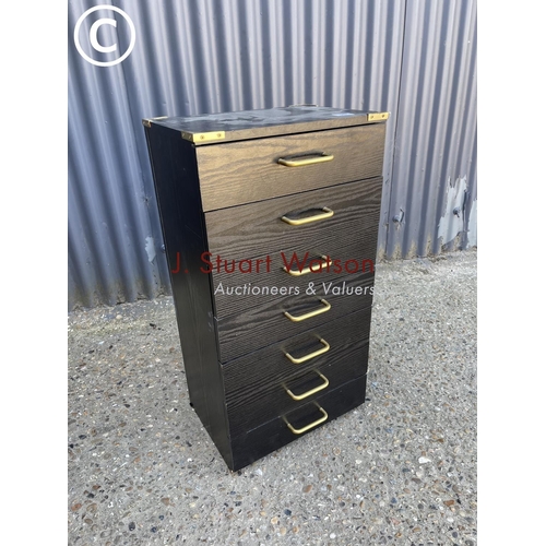 20 - A black bank of seven filing drawers