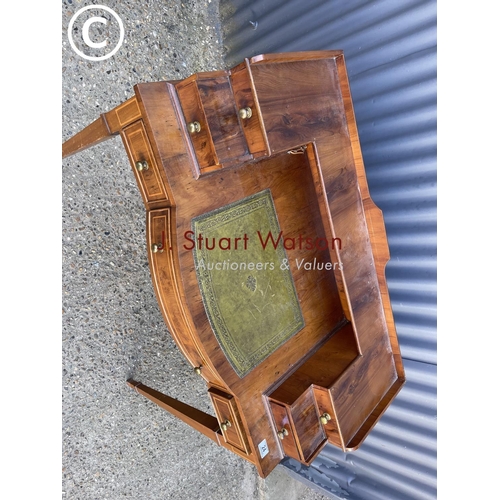 24 - A reproduction yew wood ladies writing desk