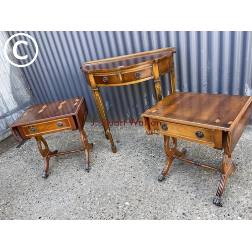 25 - A yew wood hall table together with a pair of yew single drawer lamp tables