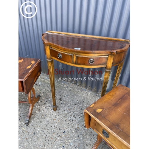 25 - A yew wood hall table together with a pair of yew single drawer lamp tables