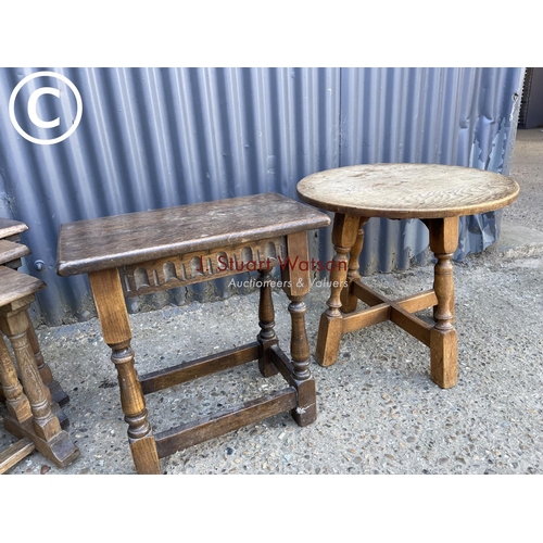 30 - An oak joint stool together with a nest of three tables and a circular occasional table