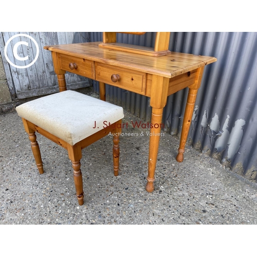 32 - A honey pine two drawer dressing table with mirror and stool