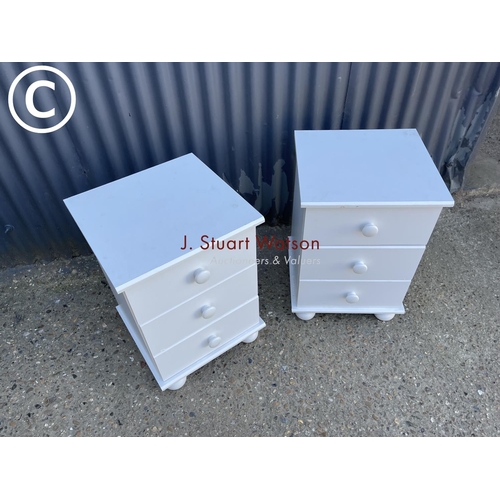 33 - A pair of modern white bedside chests of three drawers