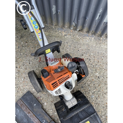 360l - A Stihl mm55 power rotovator with attachments including pair of brushes