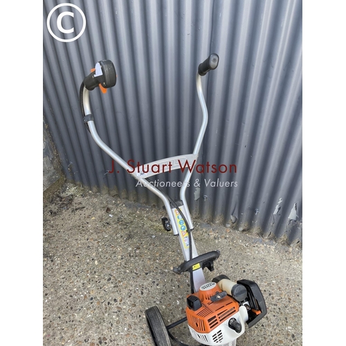 360l - A Stihl mm55 power rotovator with attachments including pair of brushes