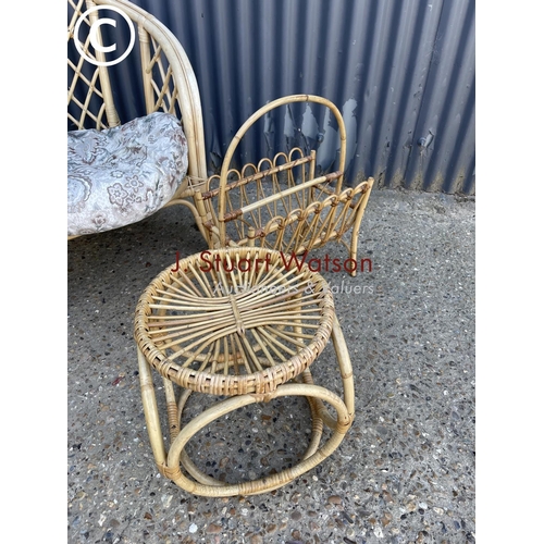 37 - A bamboo conservatory chair together with table and magazine rack