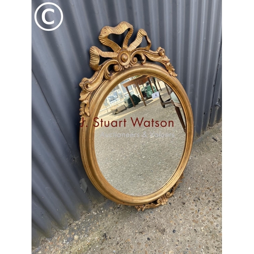 4 - An ornate gold gilt hall mirror 60w 100h