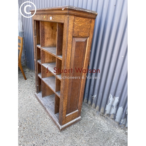 57 - An oak open fronted pigeon hole rack 90cm wide