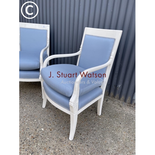 6 - A pair of continental style white painted chairs with blue upholstery