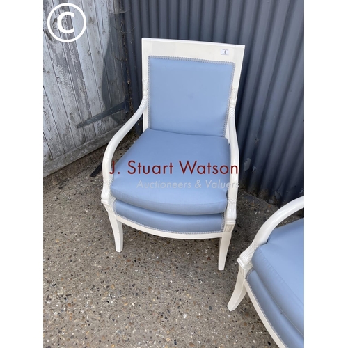 6 - A pair of continental style white painted chairs with blue upholstery