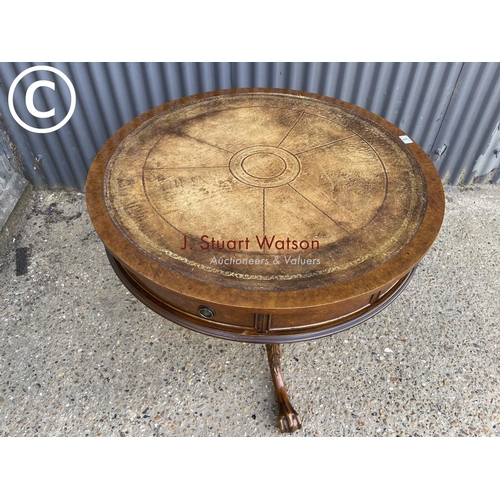 8 - A mahogany drum table with drawer and gold leather top 95cm round