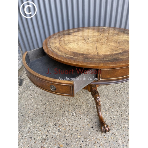 8 - A mahogany drum table with drawer and gold leather top 95cm round