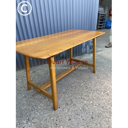 99 - An original Ercol CC41 plank Dining table 135x70x77