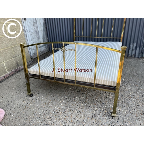 217 - An antique brass and iron bed frame 4ft