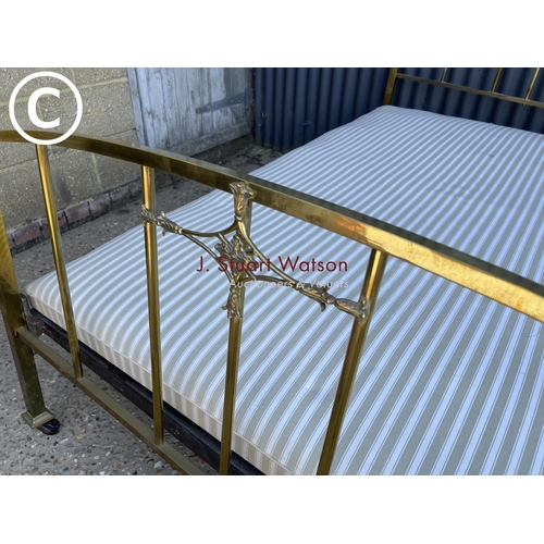 217 - An antique brass and iron bed frame 4ft