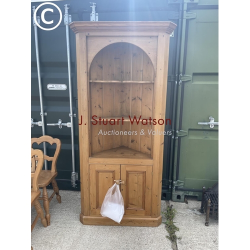 358 - A large country pine corner cupboard with open front over cupboard doors