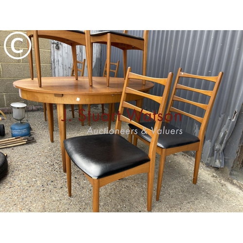 102 - A mid century teak table and six chairs by greaves and Thomas