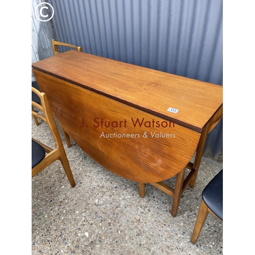 113 - A mid century teak table and four chairs