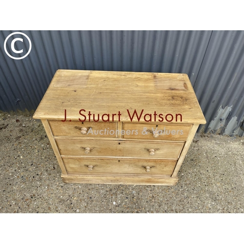 143 - A stripped pine chest of four drawers