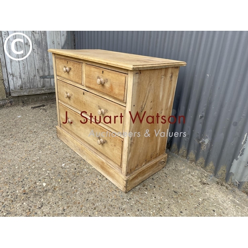 143 - A stripped pine chest of four drawers