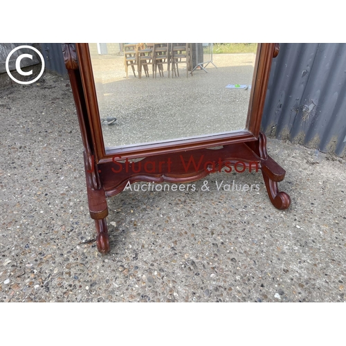 148 - A Victorian style mahogany floor standing cheval mirror