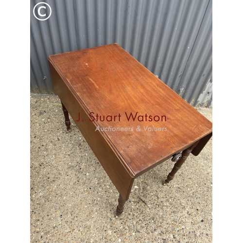 149 - A Victorian drop leaf table with drawer