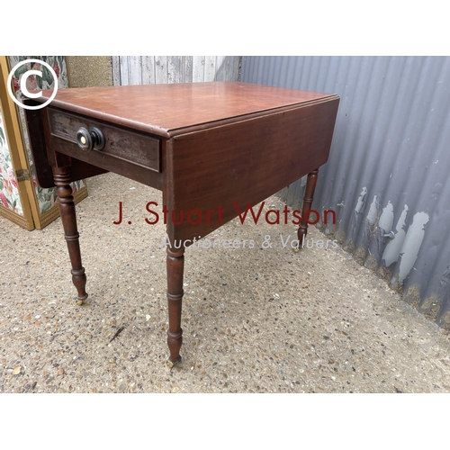 149 - A Victorian drop leaf table with drawer