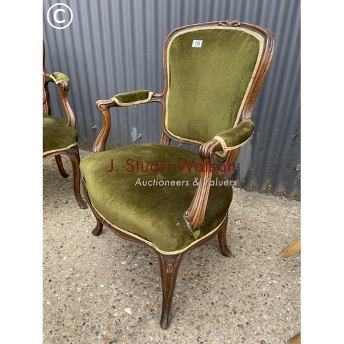 158 - A pair of green upholstered continental elbow chairs