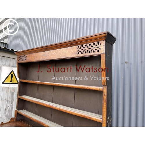 163 - A large antique oak dresser with plate rack top