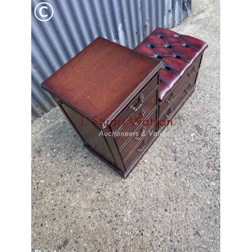 18 - A mahogany hall seat with red chesterfield seat