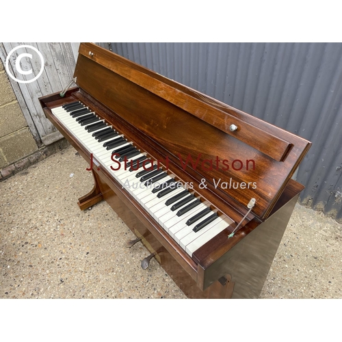 182 - A mahogany cased compact upright  piano