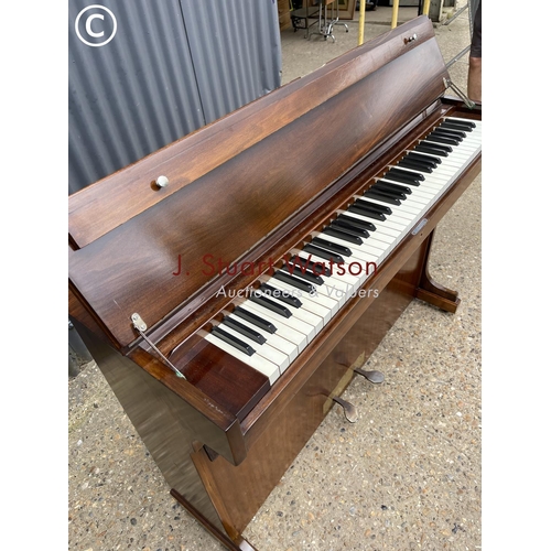 182 - A mahogany cased compact upright  piano