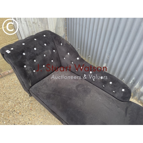 189 - A black upholstered chaise lounge with diamanté detailing