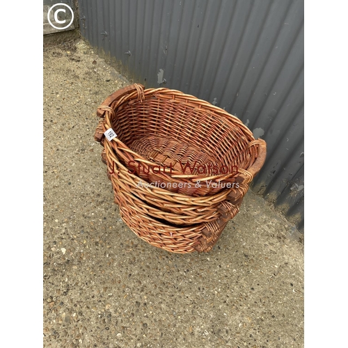 192 - A stack of ten wicker baskets