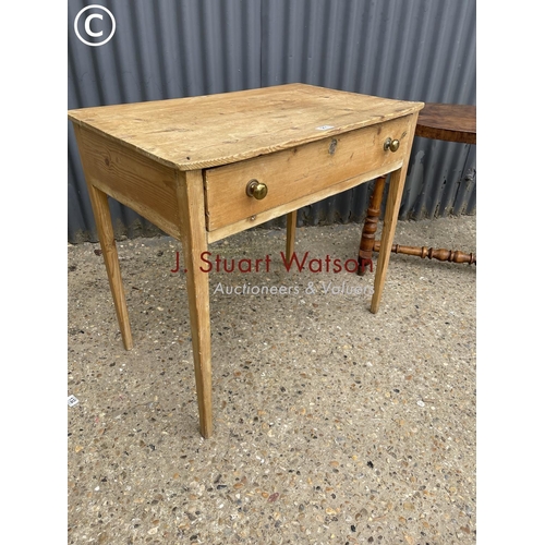 211 - A pine single drawer table together with an oval mahogany table