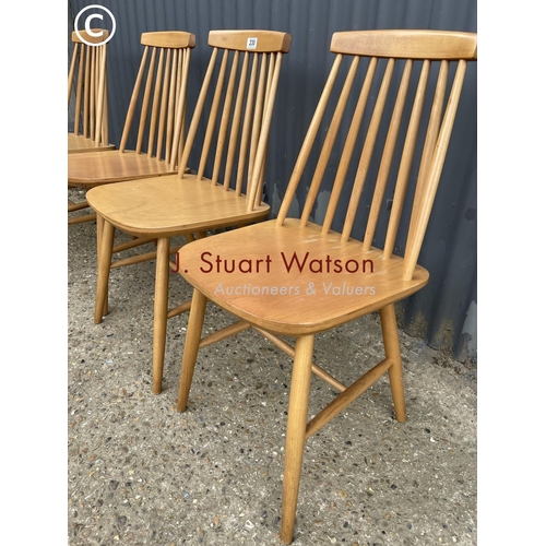 230 - Four Ercol style stick back kitchen chairs