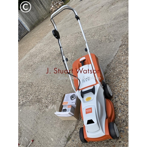 261 - A stihl cordless electric lawn mower with battery and charger in working order