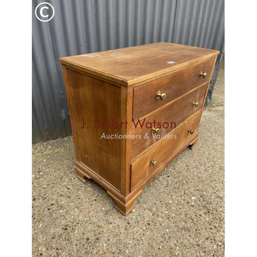 265 - An oak chest of three drawers