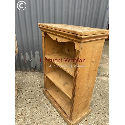 266 - A pine drop leaf kitchen table together with a small pine bookcase