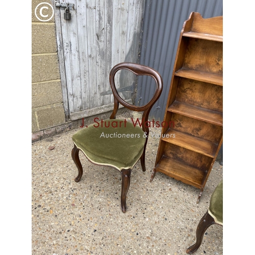 277 - A pair of balloon back chairs, book shelf and walnut chest of drawers