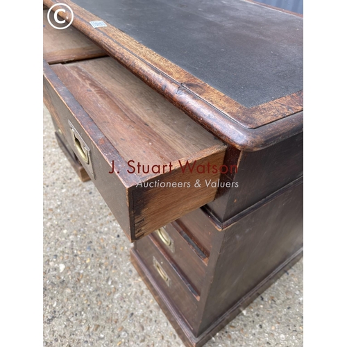 282 - A mahogany campaign style desk with military handles  122wide