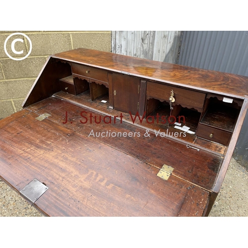 283 - A Georgian mahogany bureau with fitted interior